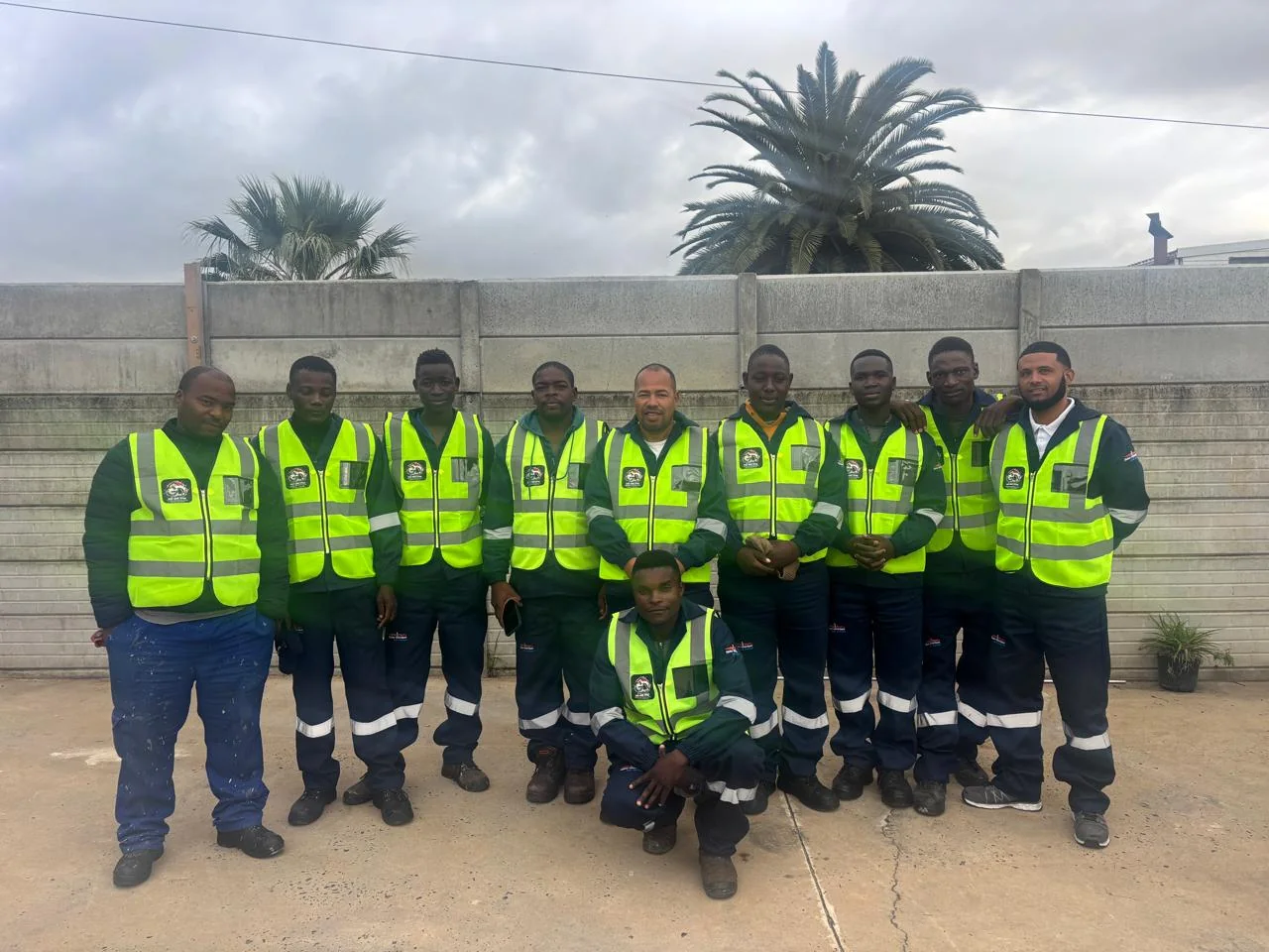 GD Roofing team photographed together in branded high-visibility workwear